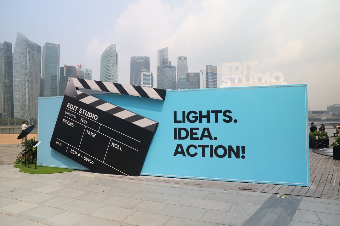 “Lights. Idea. Action!” CapCut Edit Studio installation with a giant clapperboard against the Singapore skyline