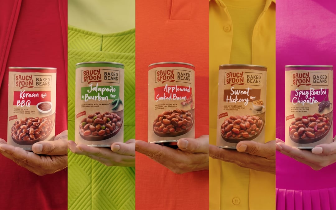 Group pack shot of the Saucy Spoon Baked Beans can lineup