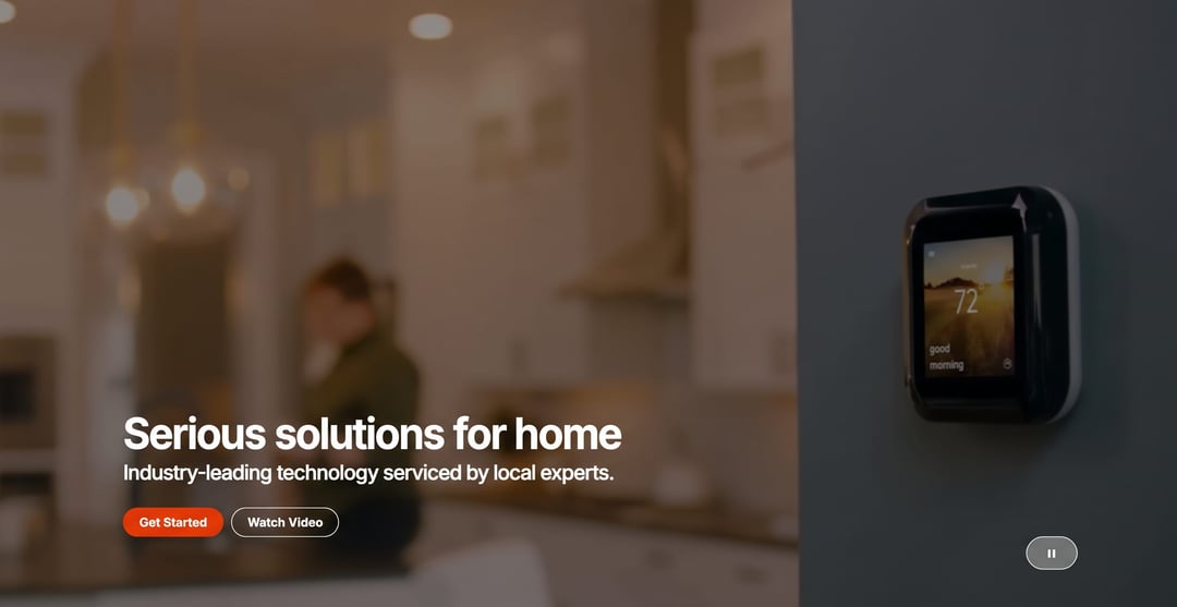 Alarm.com homepage hero showing a cross-section illustration of a smart home
